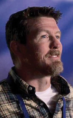 v26i8 Clayton Head Shot